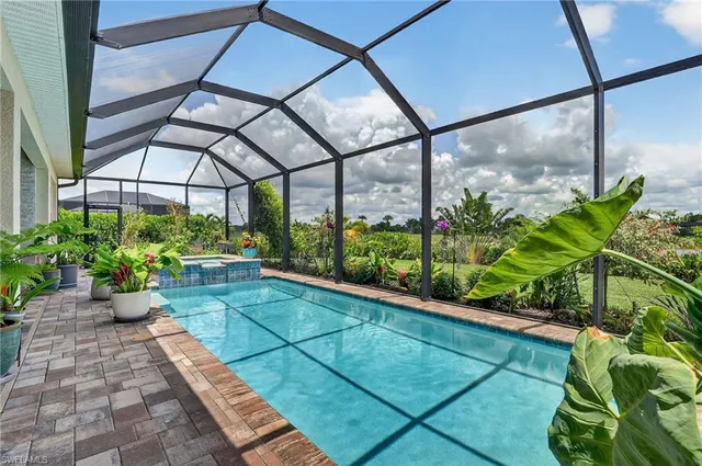a view of a backyard with sitting area