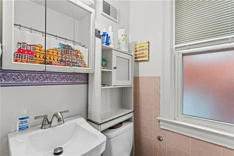 a bathroom with a sink and mirror