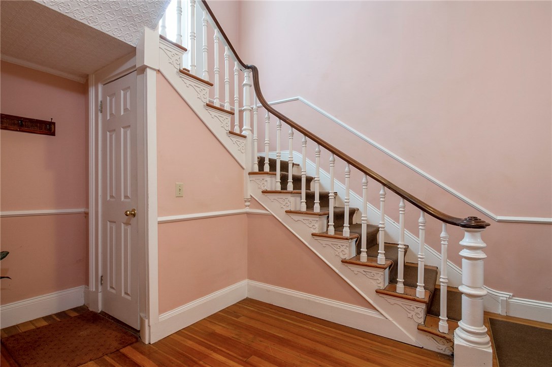 569 Spring Street, Unit 1N Newport, RI 02840 - Photo 14 of 15 Foyer with stairs to basement, Washer and Dryer in Basement, Walk out basement, storage
