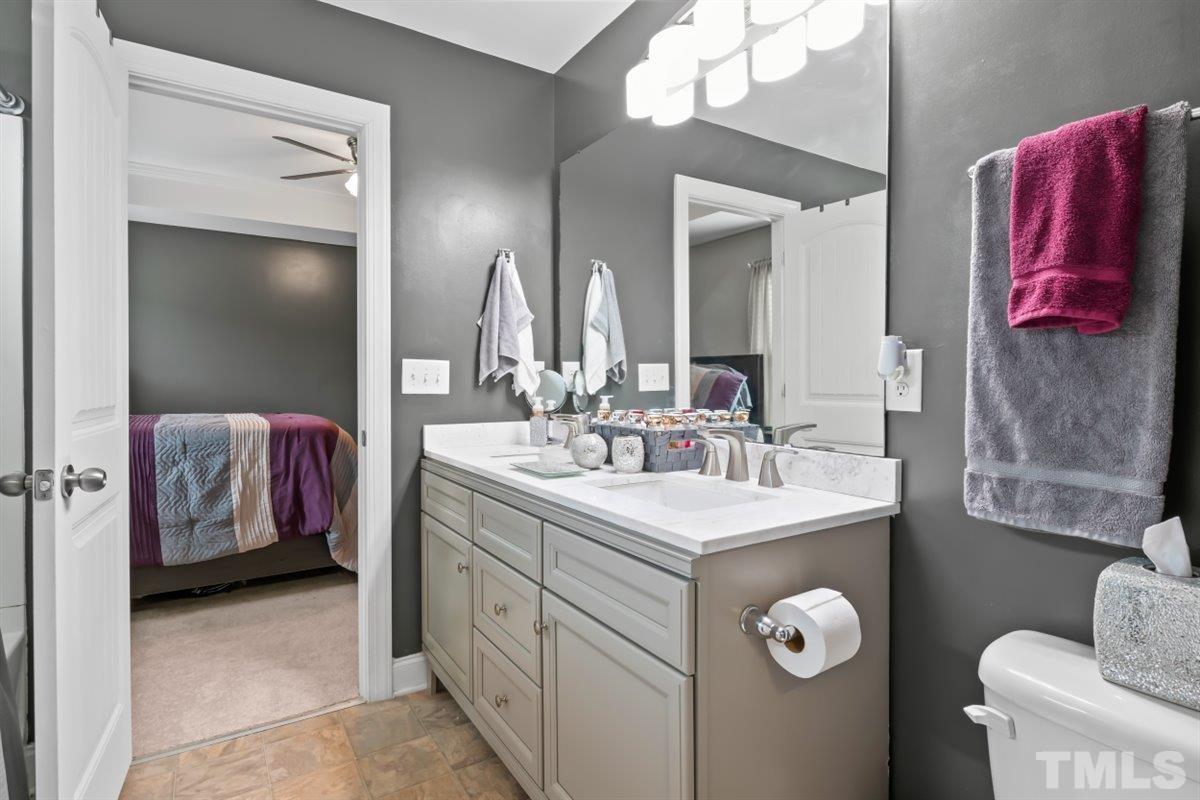3529 Eastern Branch Road Raleigh, NC 27610 - Photo 13 of 24 a bathroom with a sink vanity and mirror