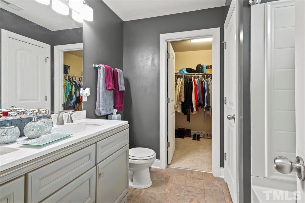 3529 Eastern Branch Road Raleigh, NC 27610 - Photo 14 of 24 a bathroom with a sink vanity and mirror