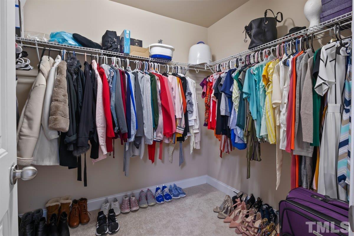 3529 Eastern Branch Road Raleigh, NC 27610 - Photo 15 of 24 a view of walk in closet with clothes