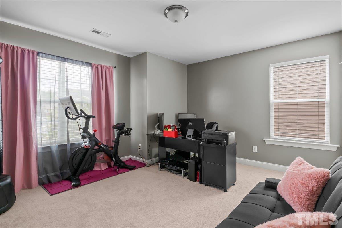 3529 Eastern Branch Road Raleigh, NC 27610 - Photo 19 of 24 a bedroom with furniture and a window