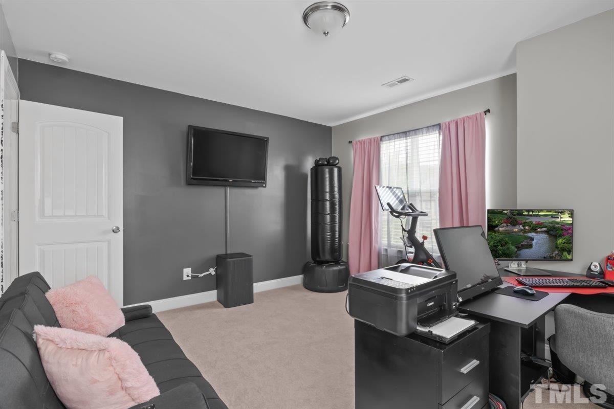 3529 Eastern Branch Road Raleigh, NC 27610 - Photo 20 of 24 a living room with furniture and a flat screen tv