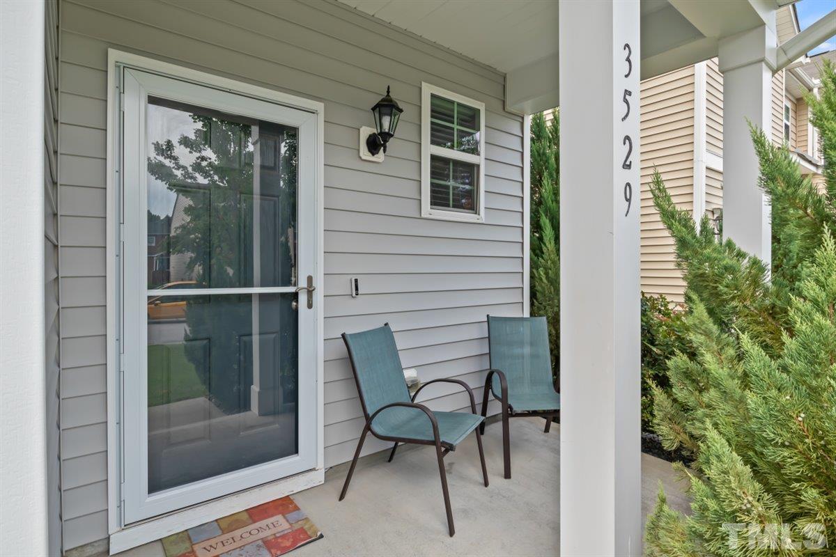 3529 Eastern Branch Road Raleigh, NC 27610 - Photo 2 of 24 a balcony with table and chairs and potted plants