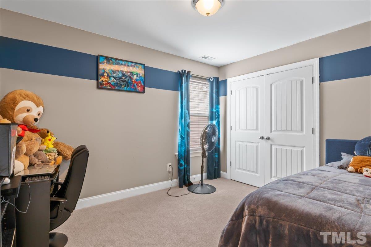 3529 Eastern Branch Road Raleigh, NC 27610 - Photo 21 of 24 a bedroom with a bed and furniture