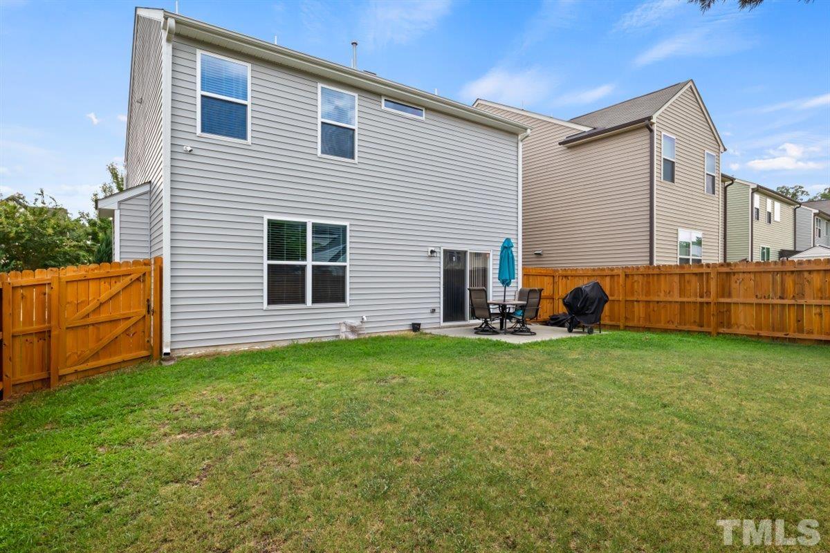 3529 Eastern Branch Road Raleigh, NC 27610 - Photo 23 of 24 a view of a house with backyard and entertaining space