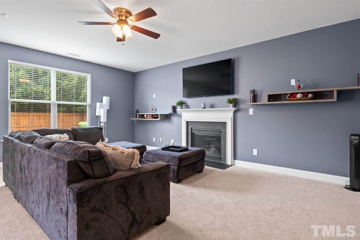 3529 Eastern Branch Road Raleigh, NC 27610 - Photo 4 of 24 a living room with furniture and a flat screen tv