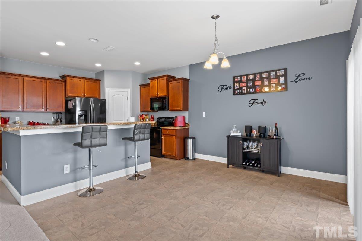 3529 Eastern Branch Road Raleigh, NC 27610 - Photo 8 of 24 a view of kitchen with furniture and windows