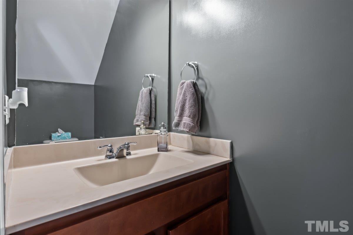 3529 Eastern Branch Road Raleigh, NC 27610 - Photo 10 of 24 a bathroom with a sink and a mirror