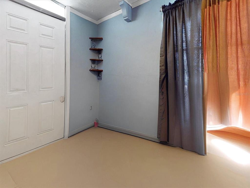 2615 Cecile Street Kissimmee, FL 34741 - Photo 11 of 30 an empty room with windows