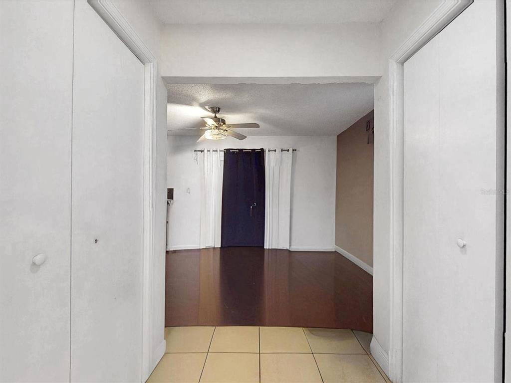 2615 Cecile Street Kissimmee, FL 34741 - Photo 16 of 30 a view of a hallway with a chandelier fan