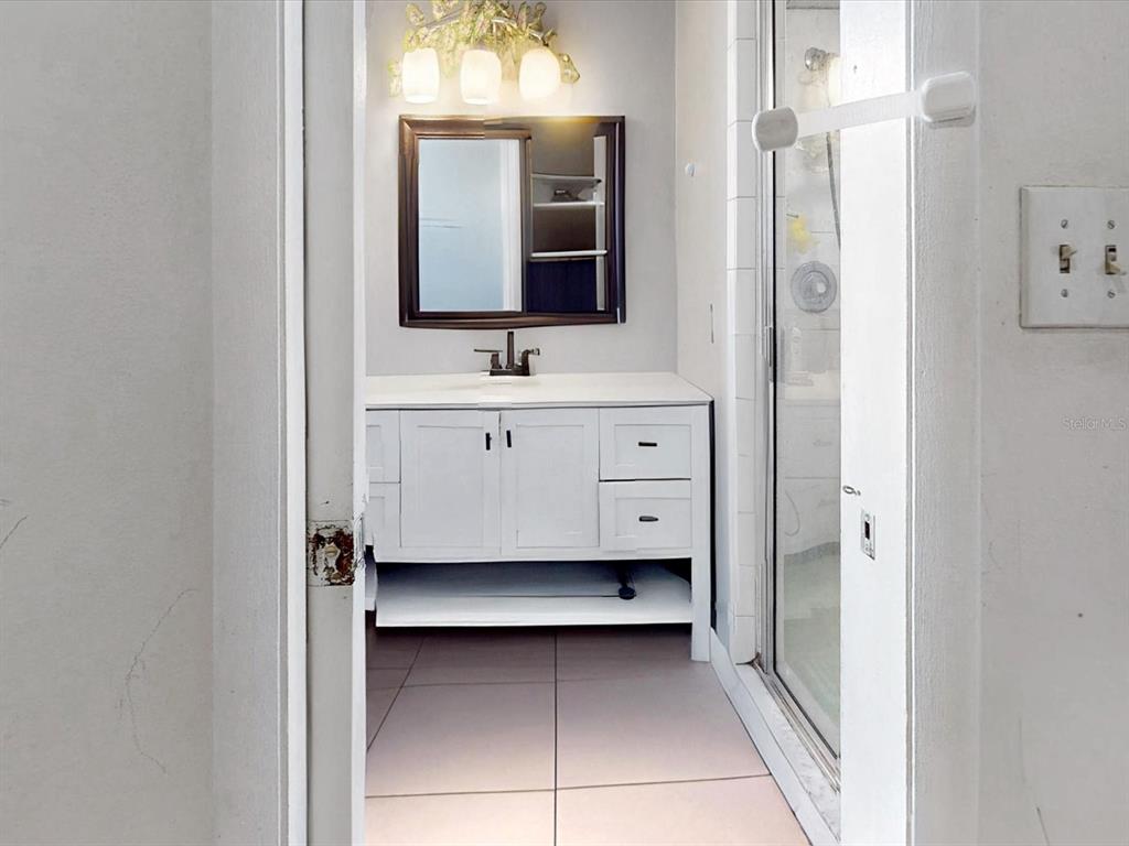 2615 Cecile Street Kissimmee, FL 34741 - Photo 17 of 30 a bathroom with a double vanity sink and mirror