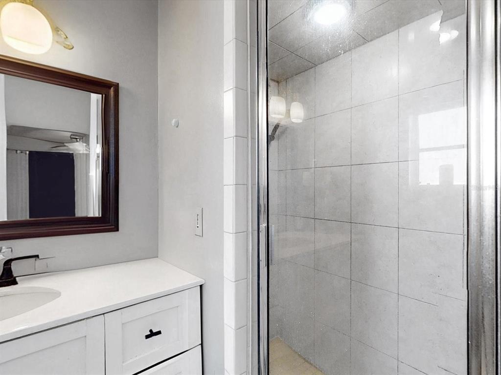 2615 Cecile Street Kissimmee, FL 34741 - Photo 19 of 30 a bathroom with a sink and a mirror