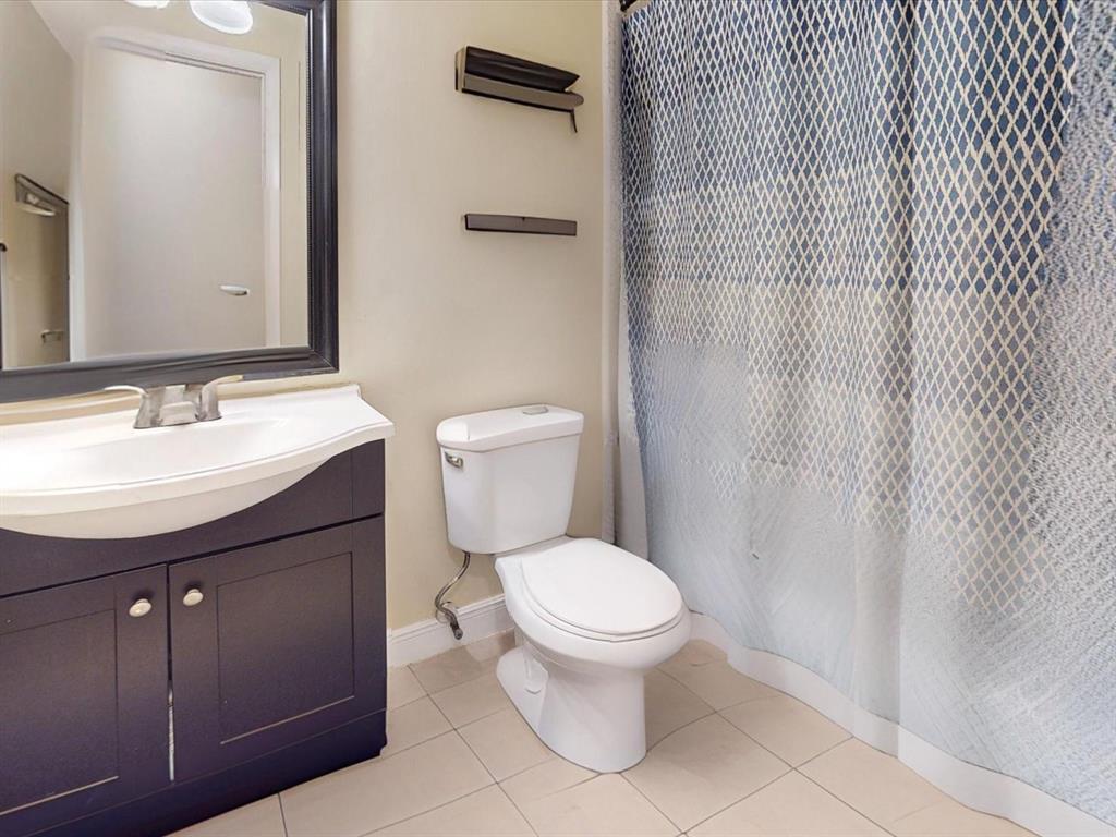 2615 Cecile Street Kissimmee, FL 34741 - Photo 21 of 30 a bathroom with a sink a toilet and shower