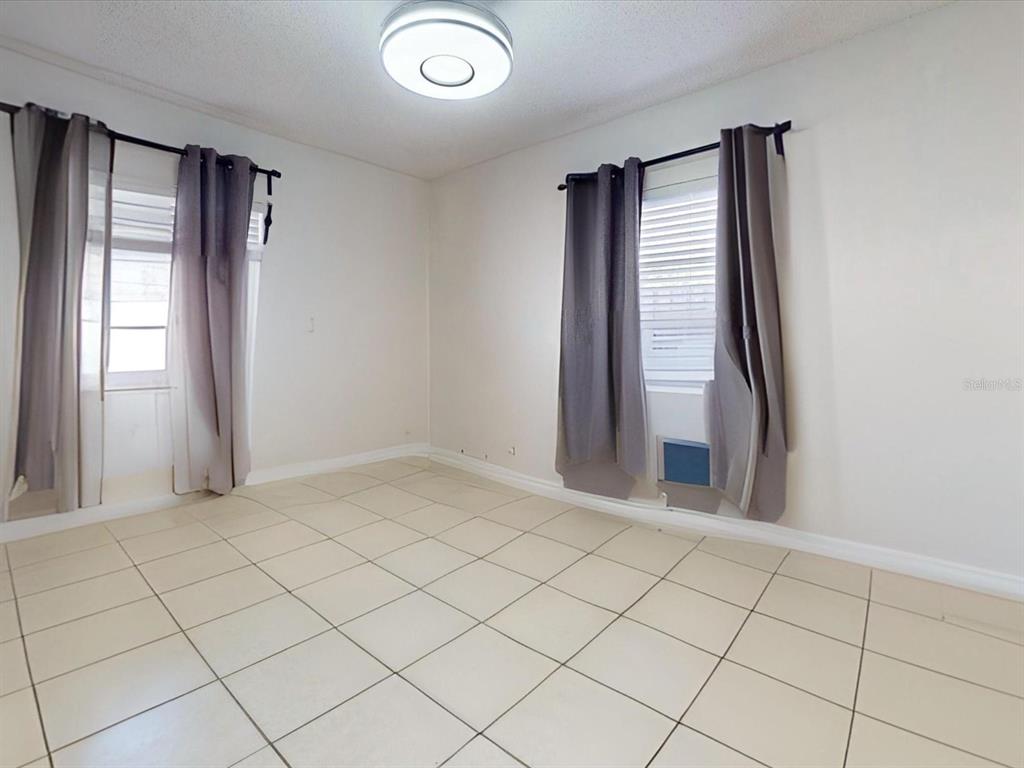 2615 Cecile Street Kissimmee, FL 34741 - Photo 22 of 30 an empty room with windows