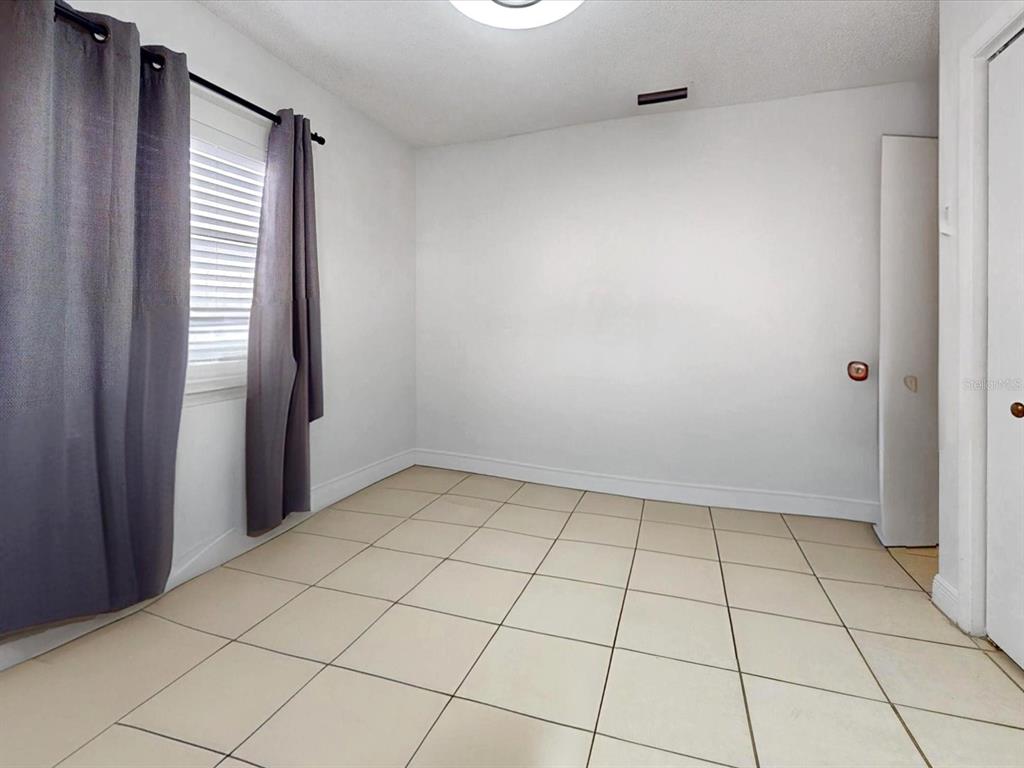 2615 Cecile Street Kissimmee, FL 34741 - Photo 23 of 30 a view of an empty room and a window