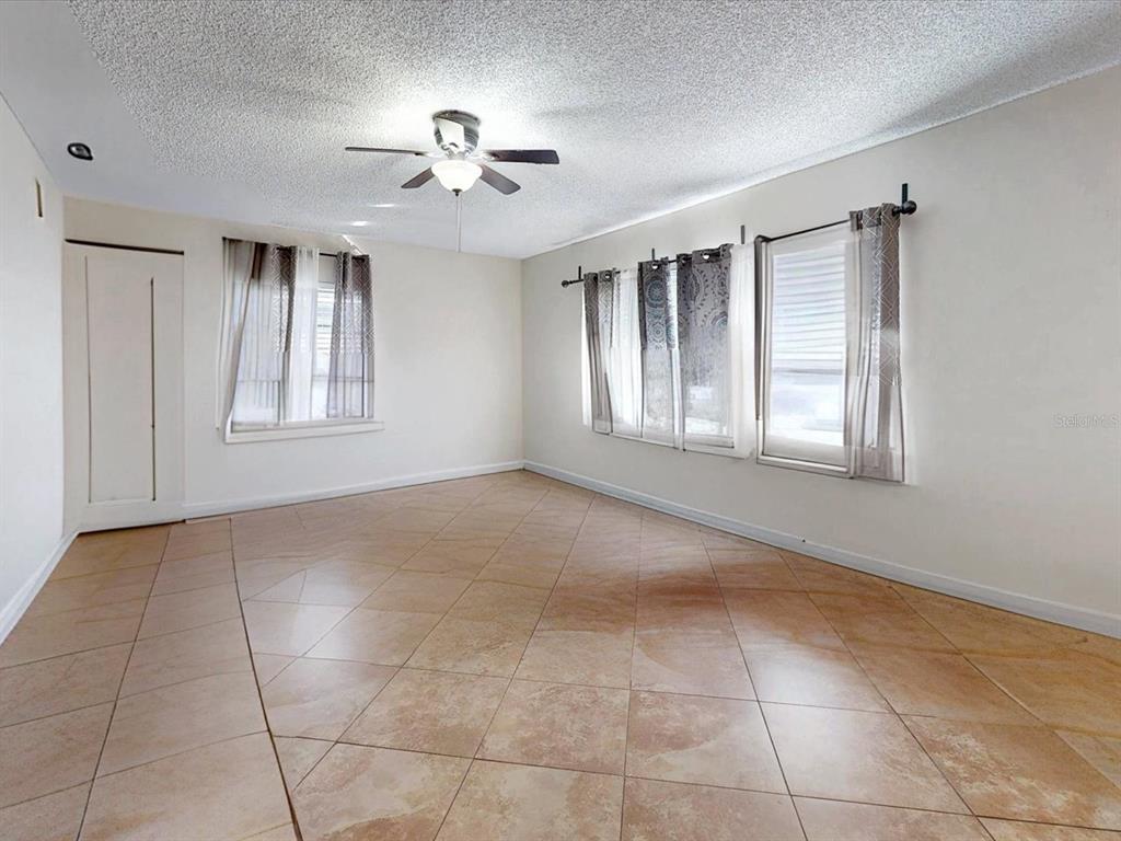 2615 Cecile Street Kissimmee, FL 34741 - Photo 4 of 30 a view of an empty room with a window