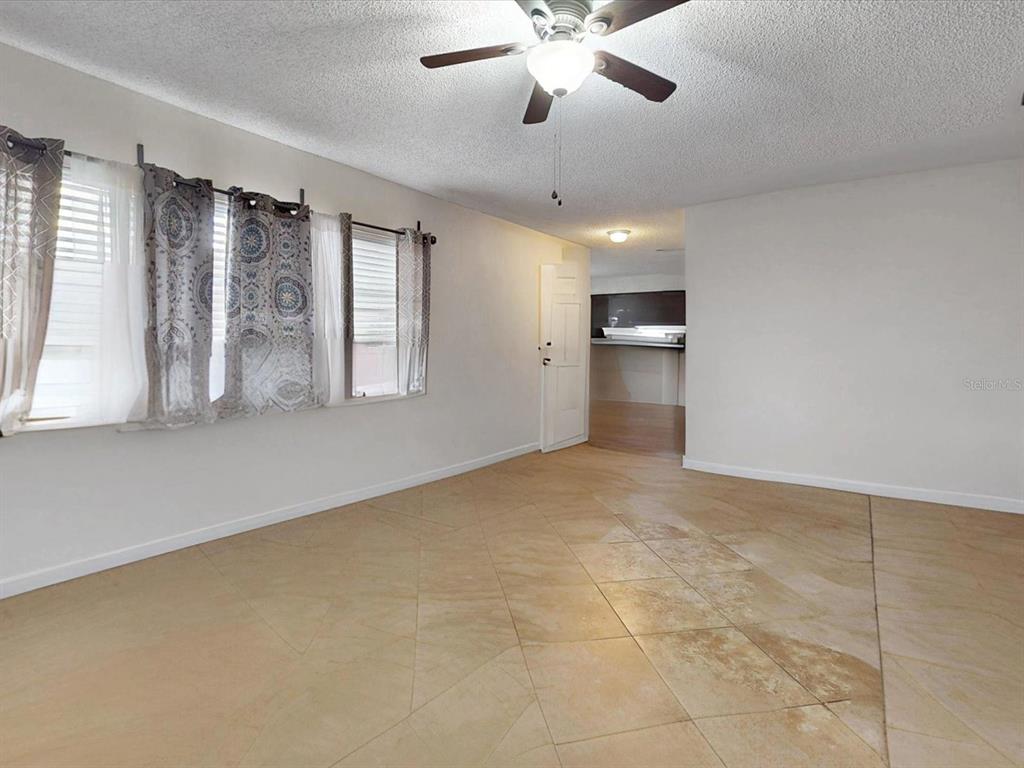 2615 Cecile Street Kissimmee, FL 34741 - Photo 5 of 30 a view of an empty room with a window
