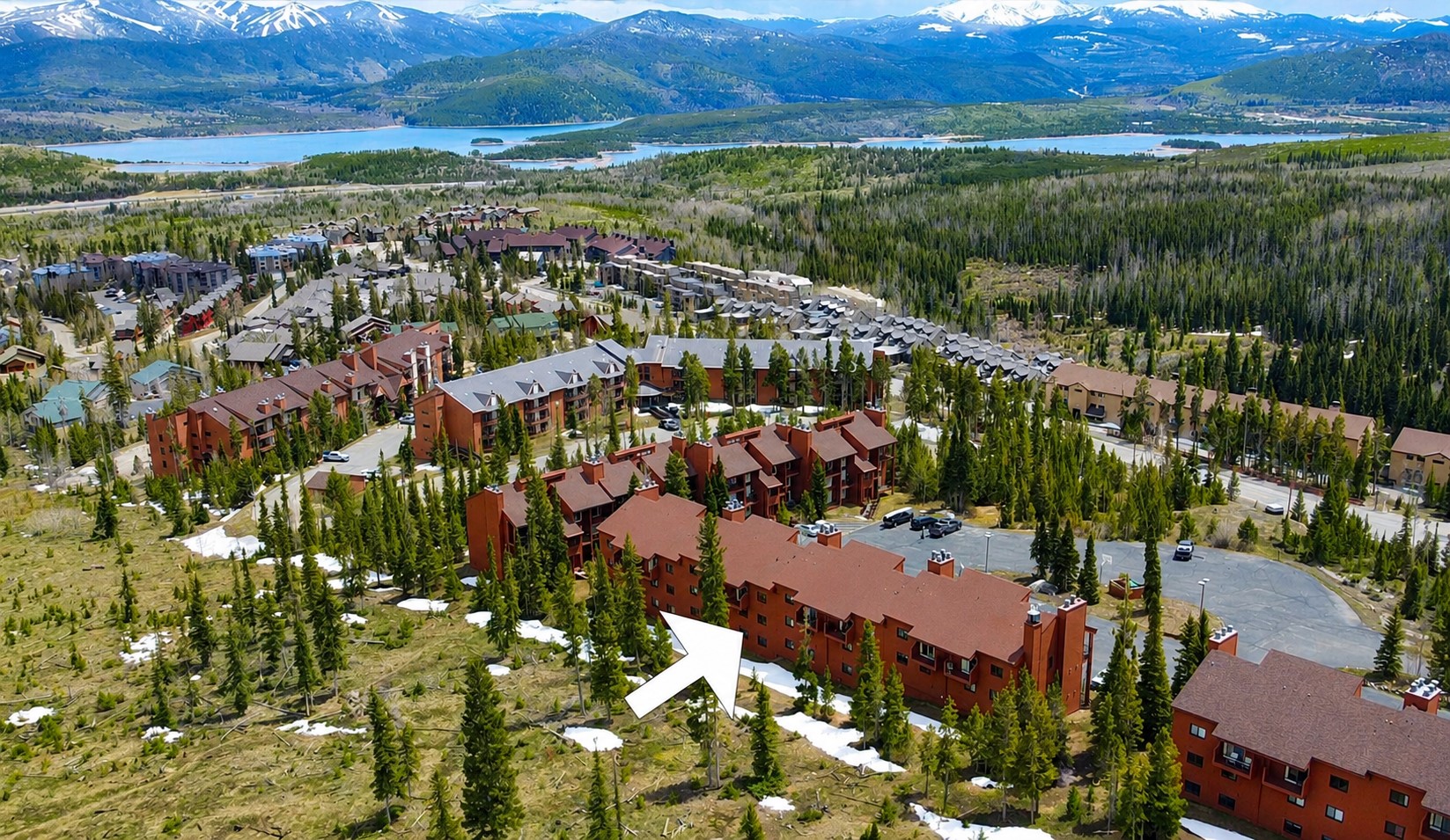 91200 Ryan Gulch Road, Unit 213 Silverthorne, CO 80498 - Photo 29 of 33 an aerial view of residential houses with outdoor space and trees