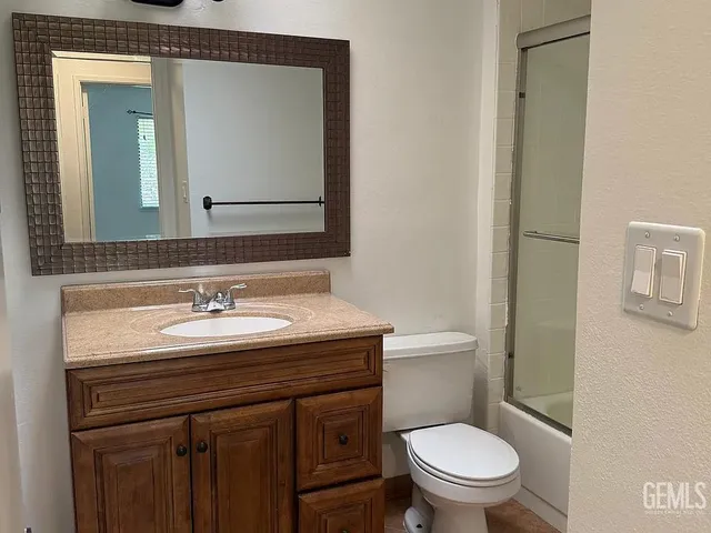 a room with a dresser and a flat screen tv