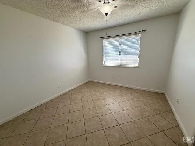 a white toilet sitting next to a shower