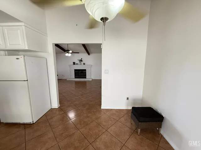 a kitchen with stainless steel appliances granite countertop a refrigerator sink and cabinets