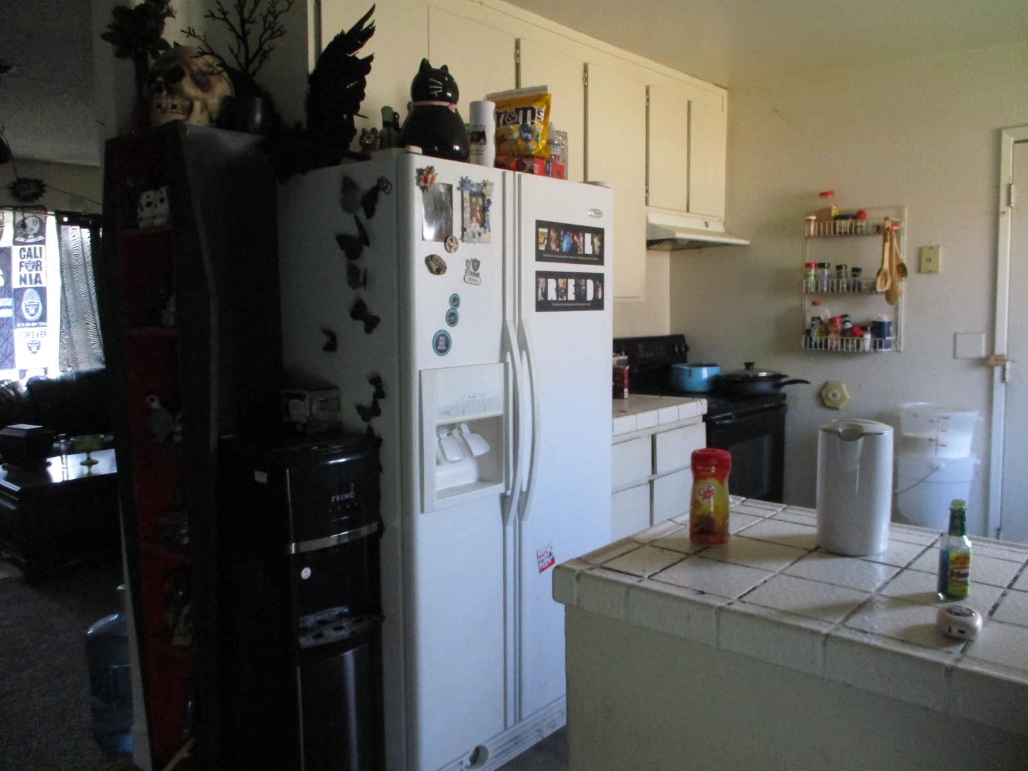 8437 Cherbourg Way Stockton, CA 95210 - Photo 11 of 28 a kitchen with a refrigerator and a stove