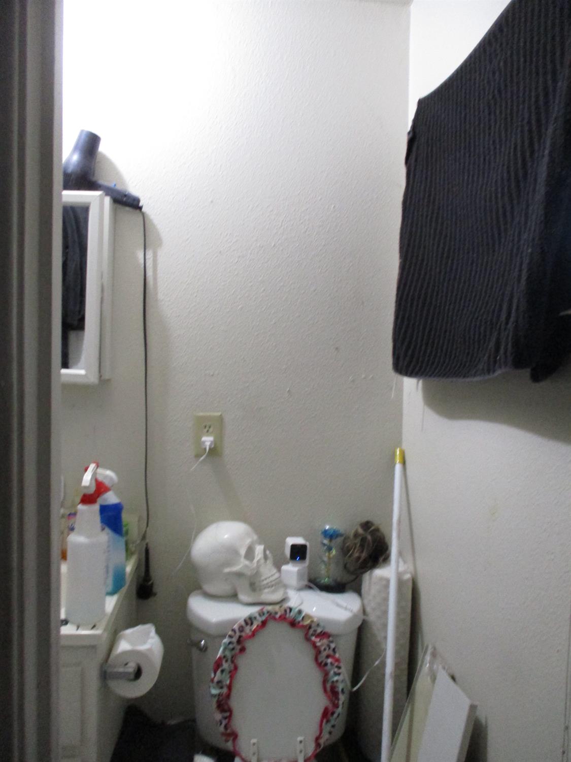 8437 Cherbourg Way Stockton, CA 95210 - Photo 20 of 28 a bathroom with a sink and toilet