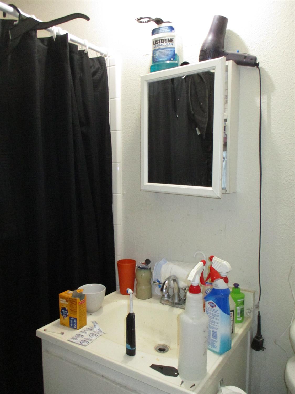 8437 Cherbourg Way Stockton, CA 95210 - Photo 21 of 28 a bathroom with a sink and mirror