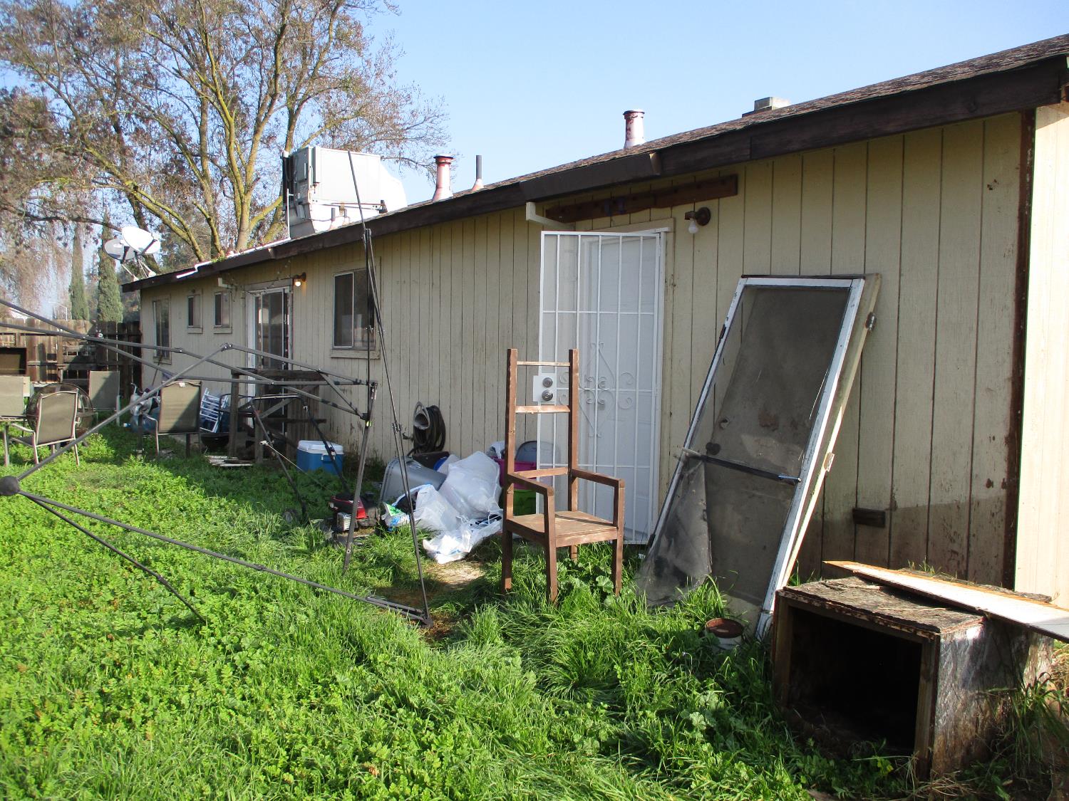 8437 Cherbourg Way Stockton, CA 95210 - Photo 24 of 28 a backyard of a house with barbeque oven table and chairs