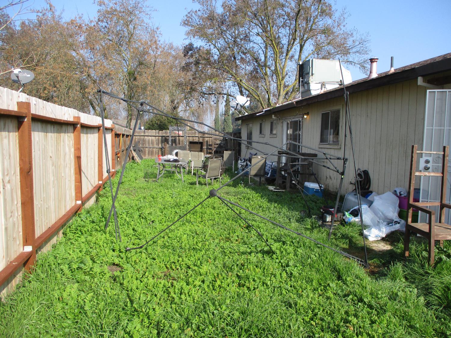 8437 Cherbourg Way Stockton, CA 95210 - Photo 25 of 28 a backyard of a house with lots of green space