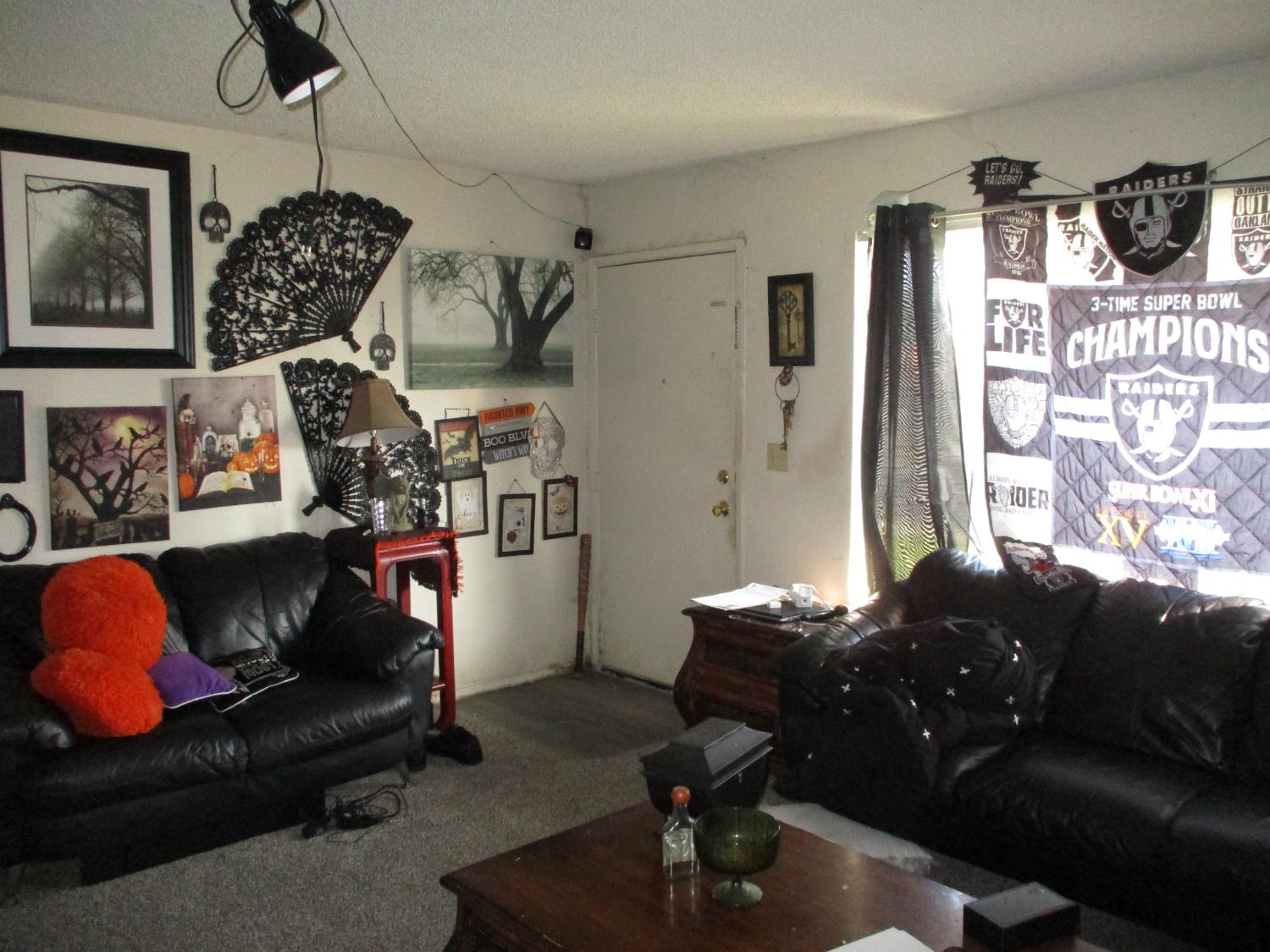8437 Cherbourg Way Stockton, CA 95210 - Photo 5 of 28 a living room with furniture flowerpot and a window