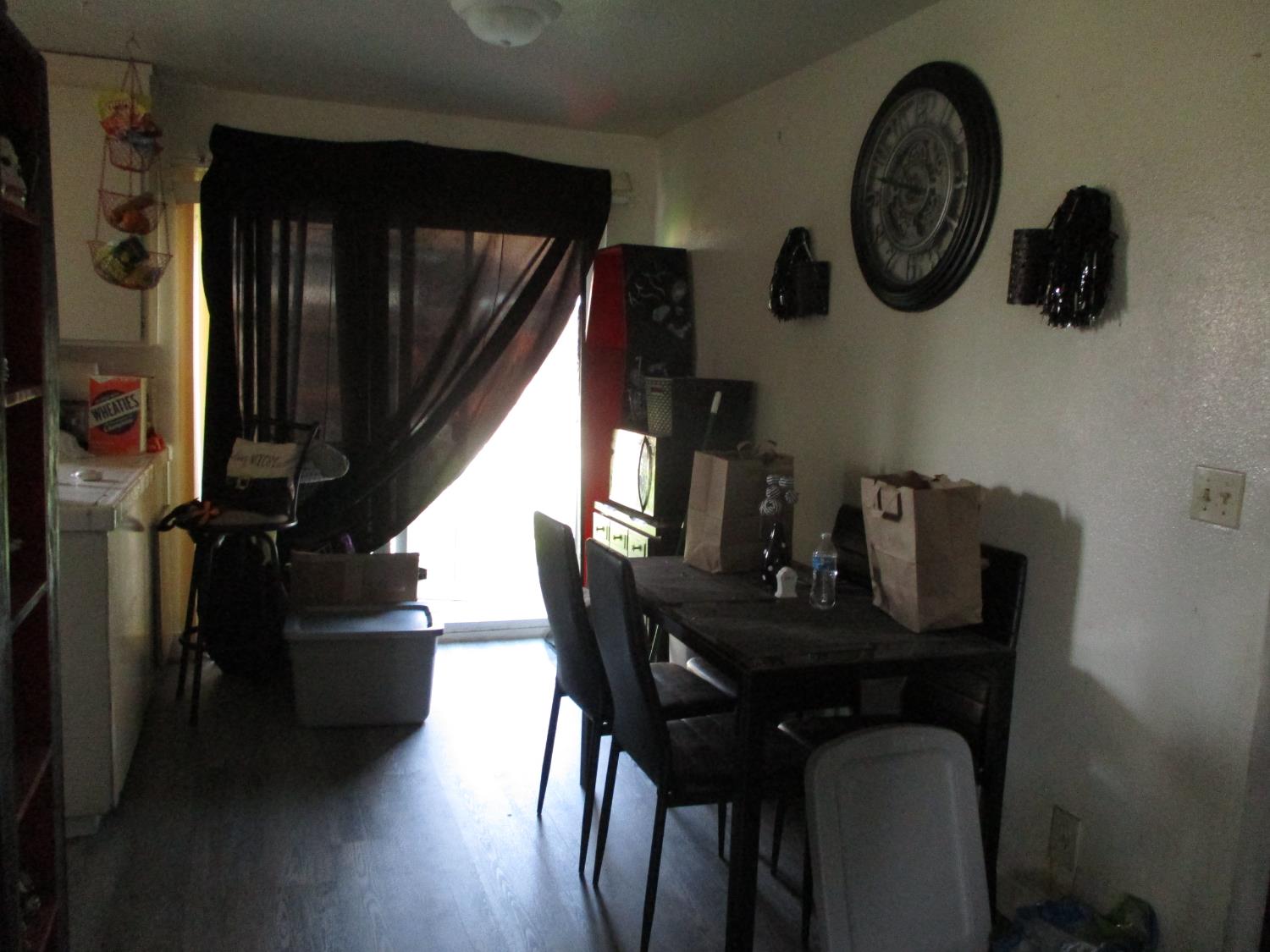 8437 Cherbourg Way Stockton, CA 95210 - Photo 7 of 28 a view of a dining room with furniture and wooden floor