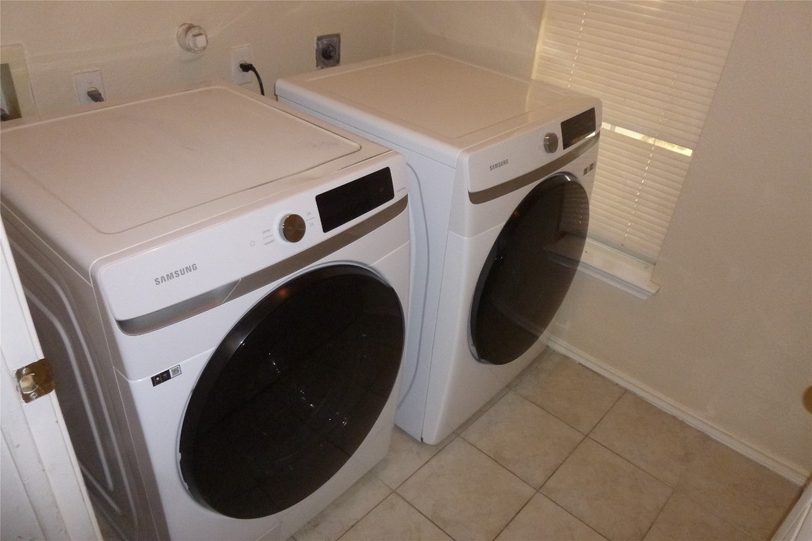 1016 Stacia's Way Pflugerville, TX 78660 - Photo 29 of 34 Laundry room featuring tile floor washer and dryer