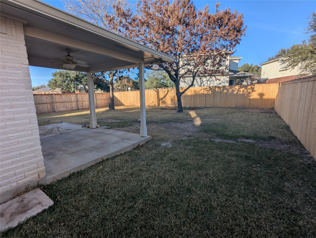 1016 Stacia's Way Pflugerville, TX 78660 - Photo 33 of 34 Fenced backyard with a covered patio & ceiling fan