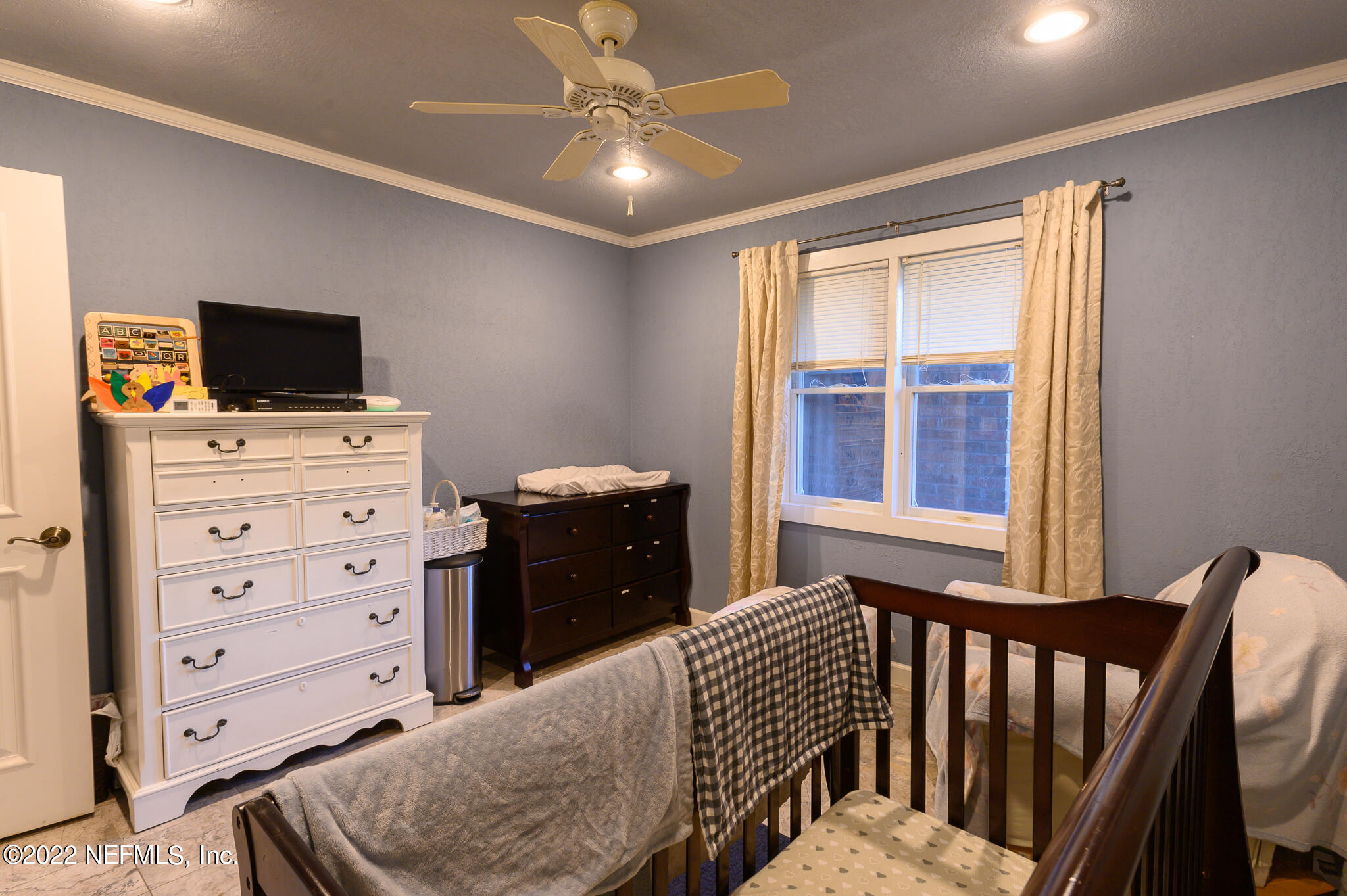 861 Orangewood Road Jacksonville, FL 32259 - Photo 29 of 41 a bedroom with furniture and flat screen tv