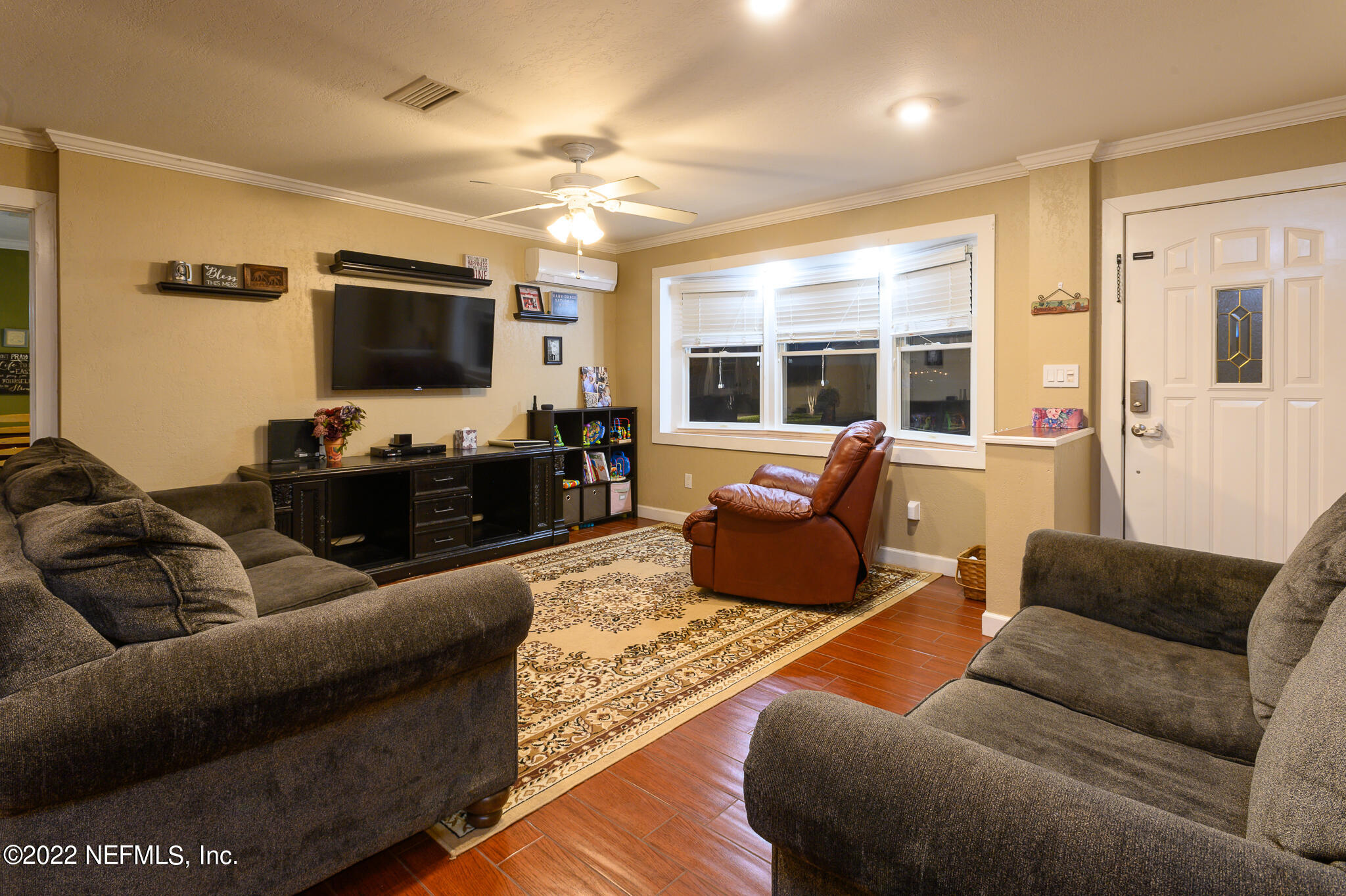 861 Orangewood Road Jacksonville, FL 32259 - Photo 8 of 41 a living room with furniture and a flat screen tv