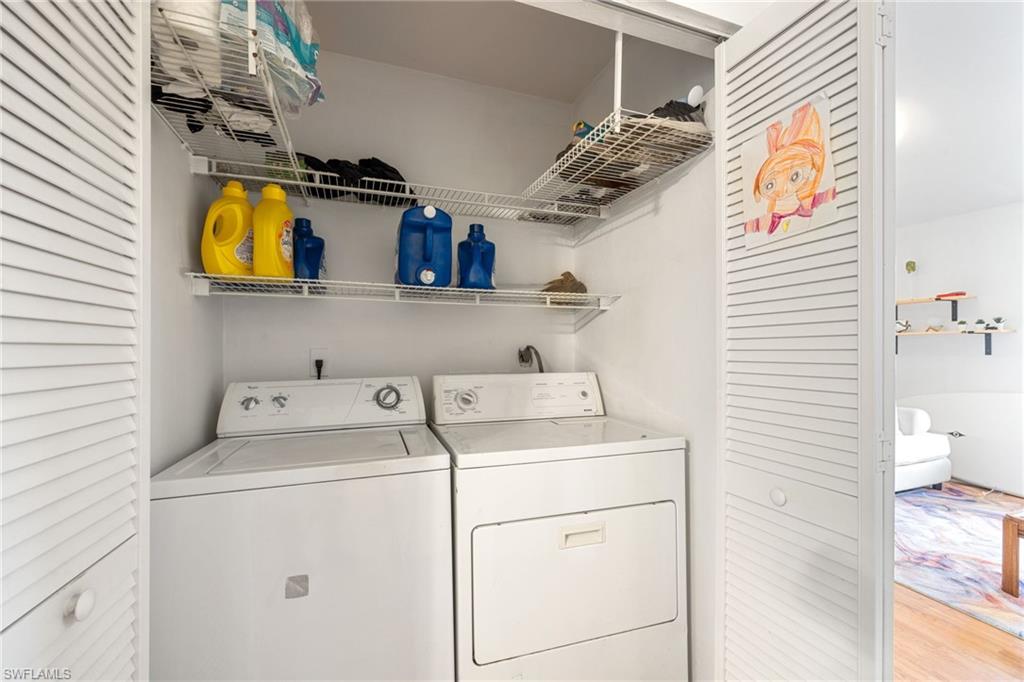 5406 16th Place Southwest, Unit E4 Naples, FL 34116 - Photo 7 of 26 a utility room with dryer and washer