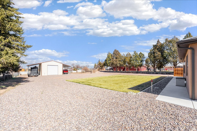 357 East Main Street Enterprise, UT 84725 - Photo 60 of 71 View of yard with an outbuilding, a garage, and driveway