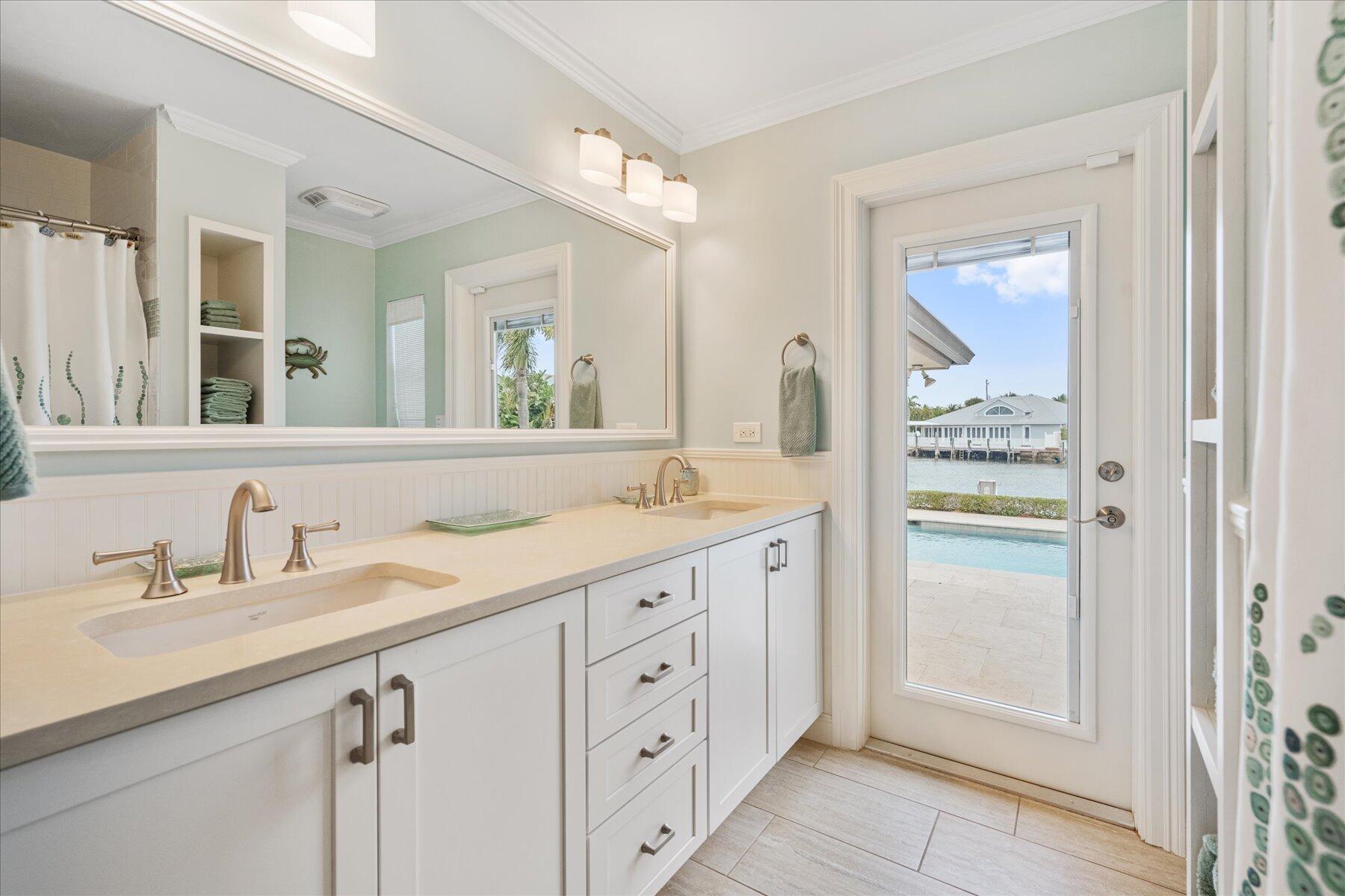 1180 Singer Drive Singer Island, FL 33404 - Photo 15 of 24 a bathroom with a granite countertop sink mirror and