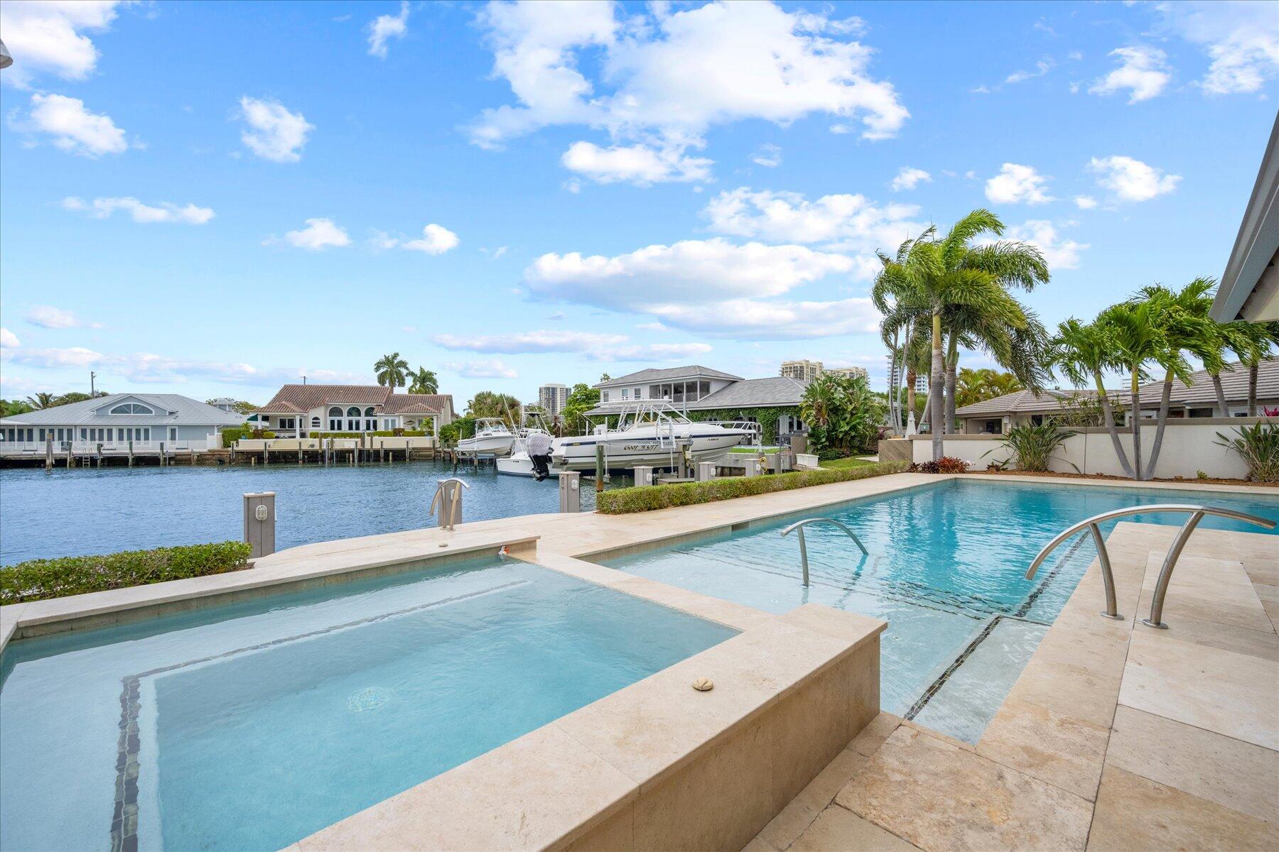 1180 Singer Drive Singer Island, FL 33404 - Photo 3 of 24 a view of swimming pool with outdoor seating and plants