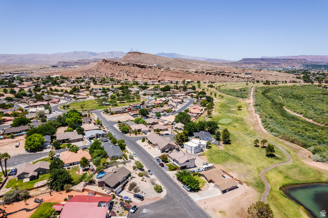 1470 Redwood Tree Street St. George, UT 84790 - Photo 44 of 53 Aerial perspective showcasing a residential community bordered by natural terrain