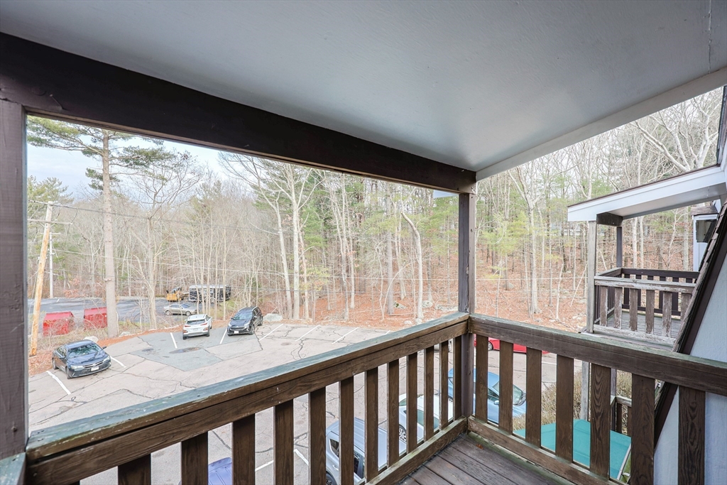 16 Erick Road, Unit 34 Mansfield, MA 02048 - Photo 12 of 14 a room with large windows and table