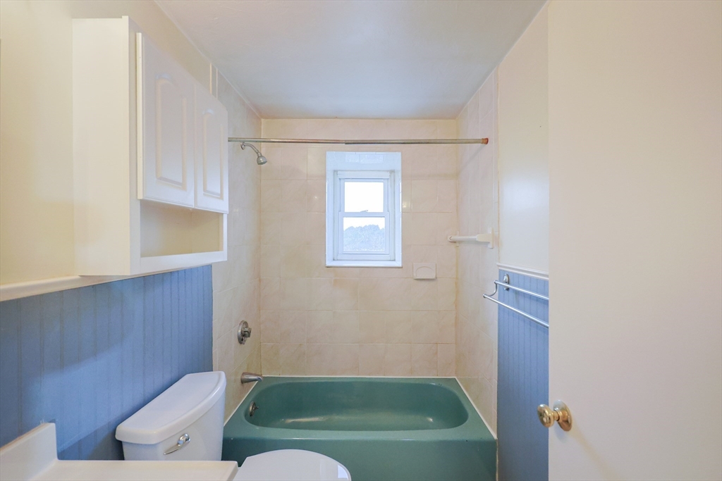 16 Erick Road, Unit 34 Mansfield, MA 02048 - Photo 7 of 14 a bathroom with a bathtub