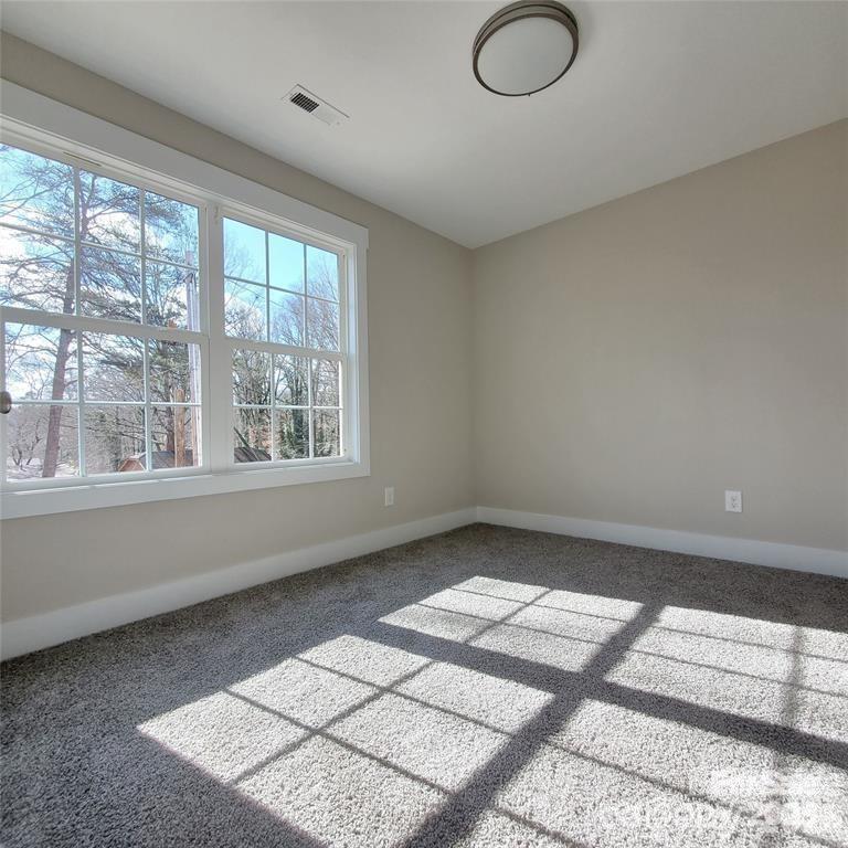 606 East Carpenter Street Dallas, NC 28034 - Photo 5 of 9 a view of an empty room and window
