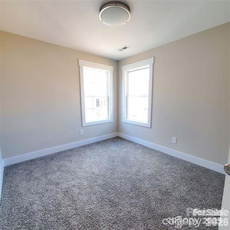 606 East Carpenter Street Dallas, NC 28034 - Photo 6 of 9 an empty room with windows