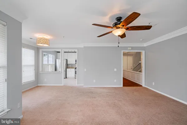 a view of a hallway with white walls and sliding door