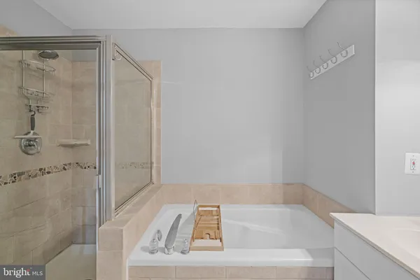 a bathroom with a shower and a sink