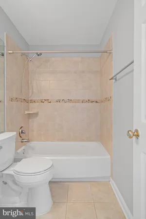 a bathroom with a sink a light fixture and a mirror